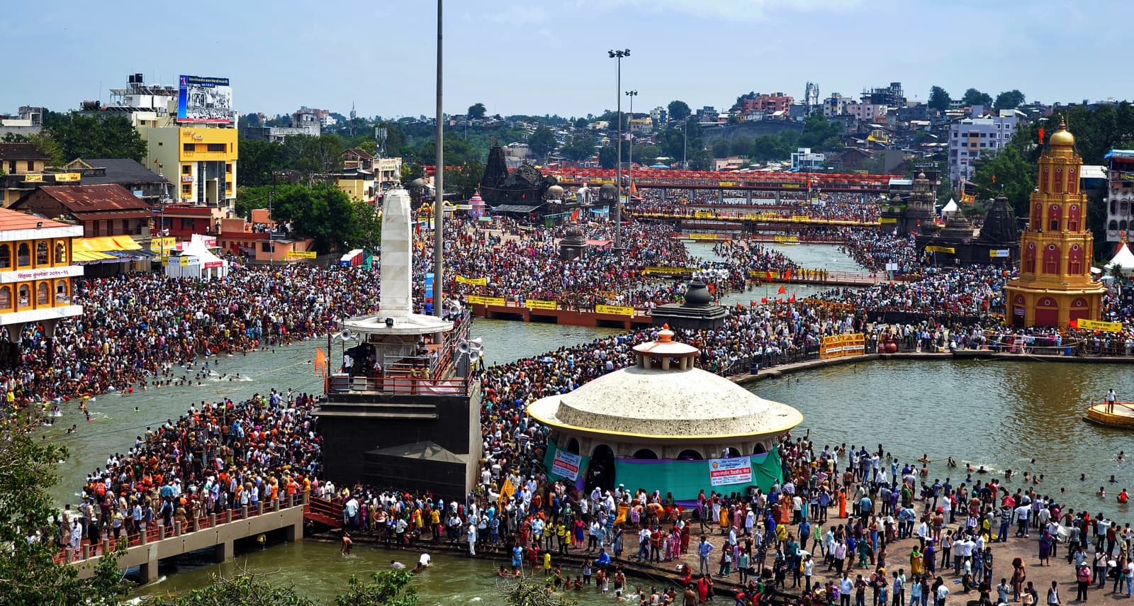 The Godavari ghats at Nashik during Kumbha Mela — pilgrims line the river steps at dawn